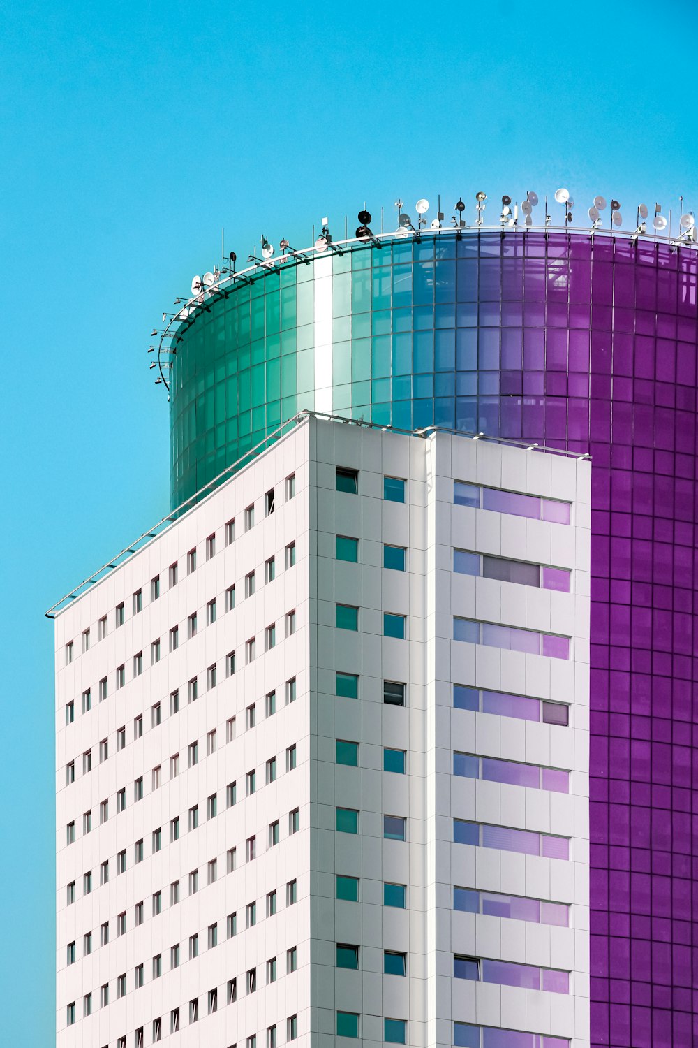 a tall building with a blue sky