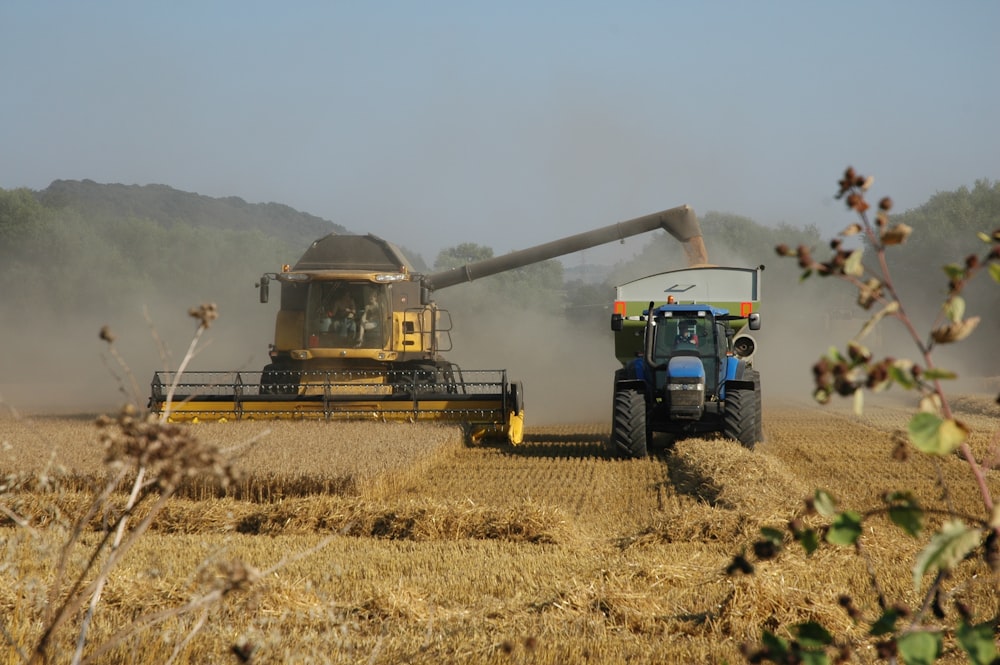 a few farm machines working in a field