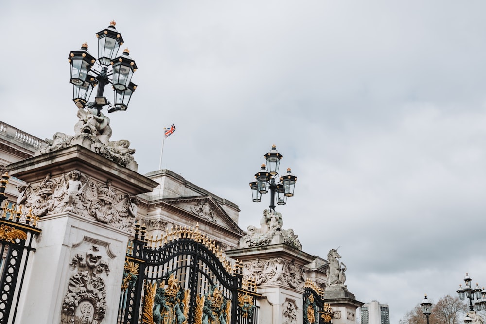 a building with a gate and a flag on top