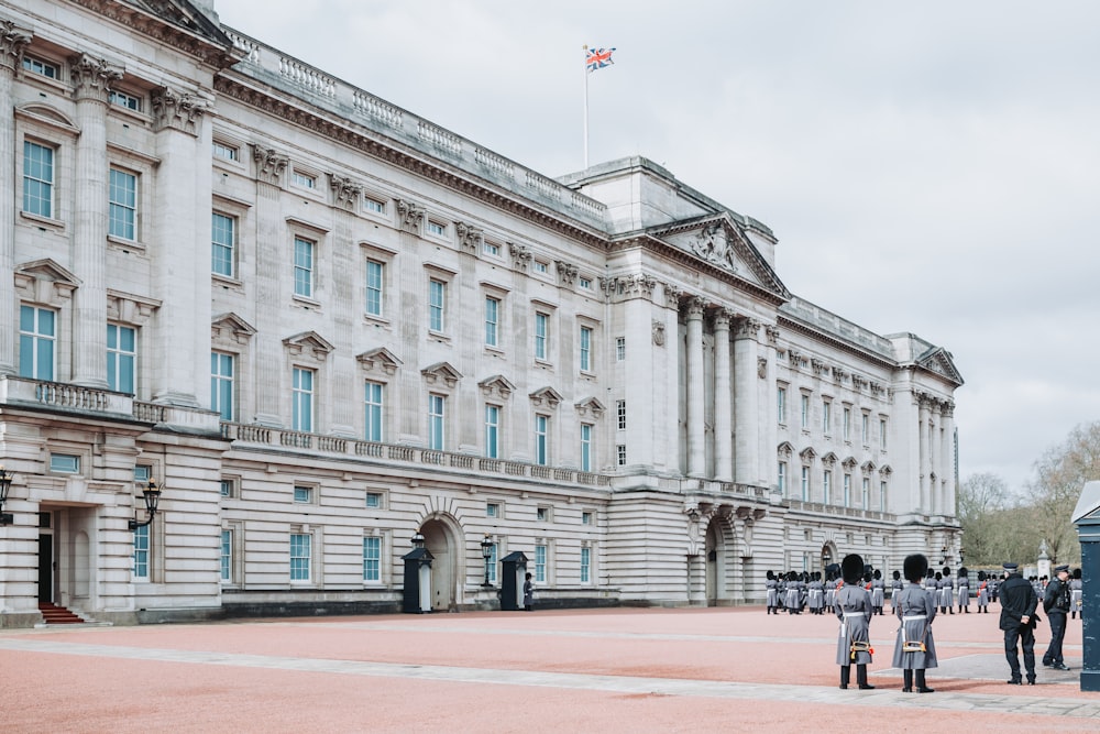 a large white building with a flag on top