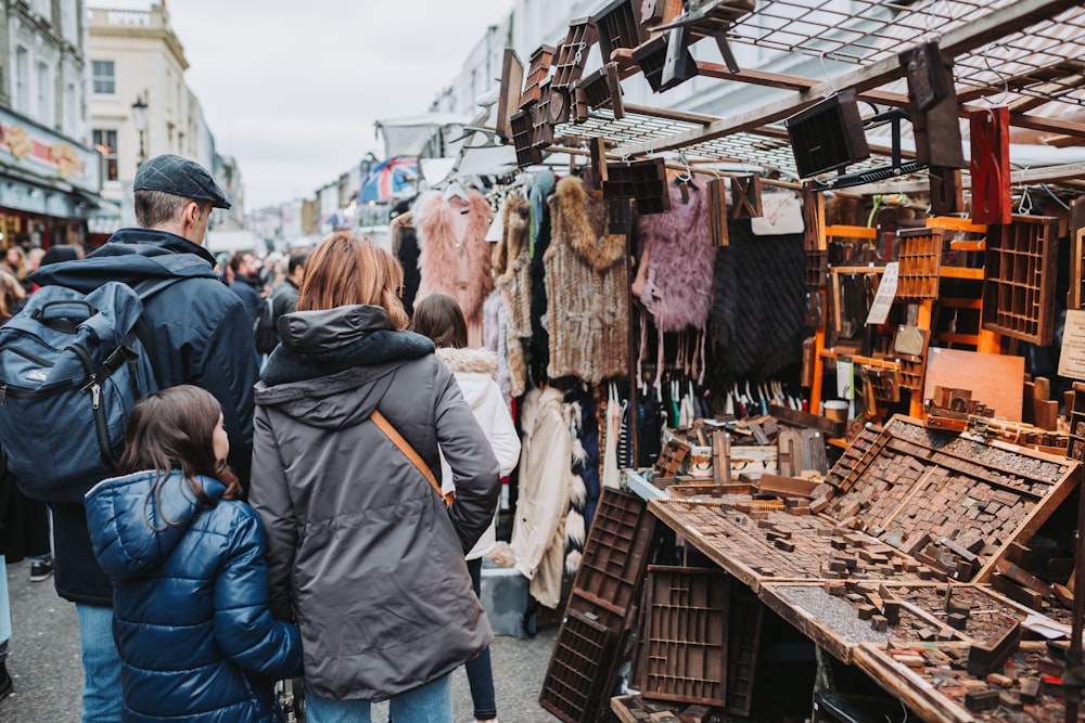 people walking near a market