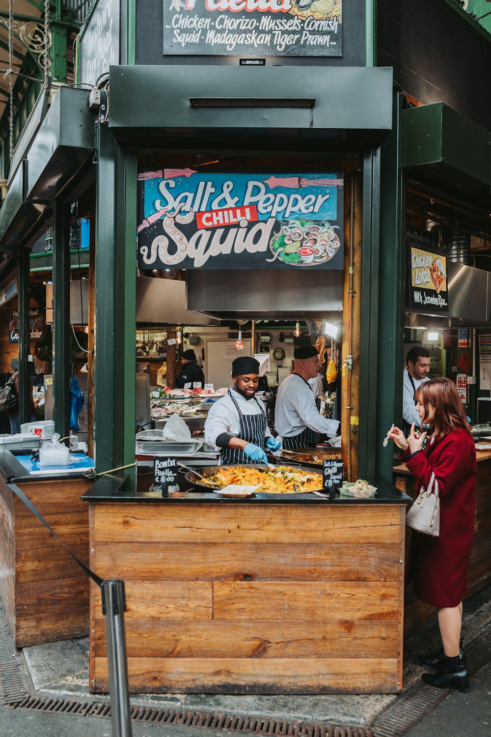 a person cooking food in a street