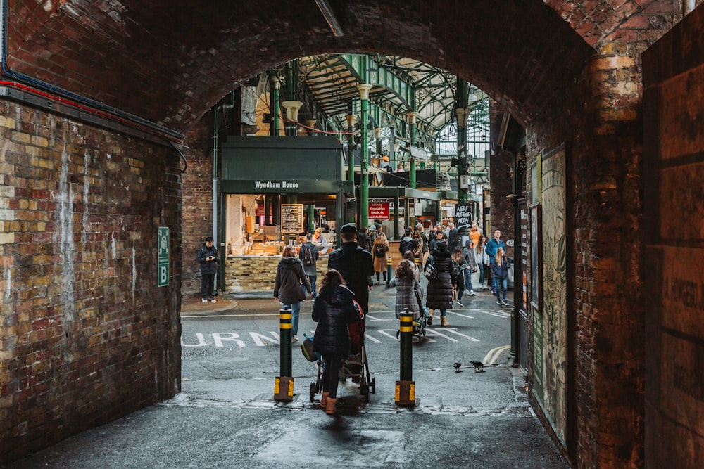 people walking in a tunnel