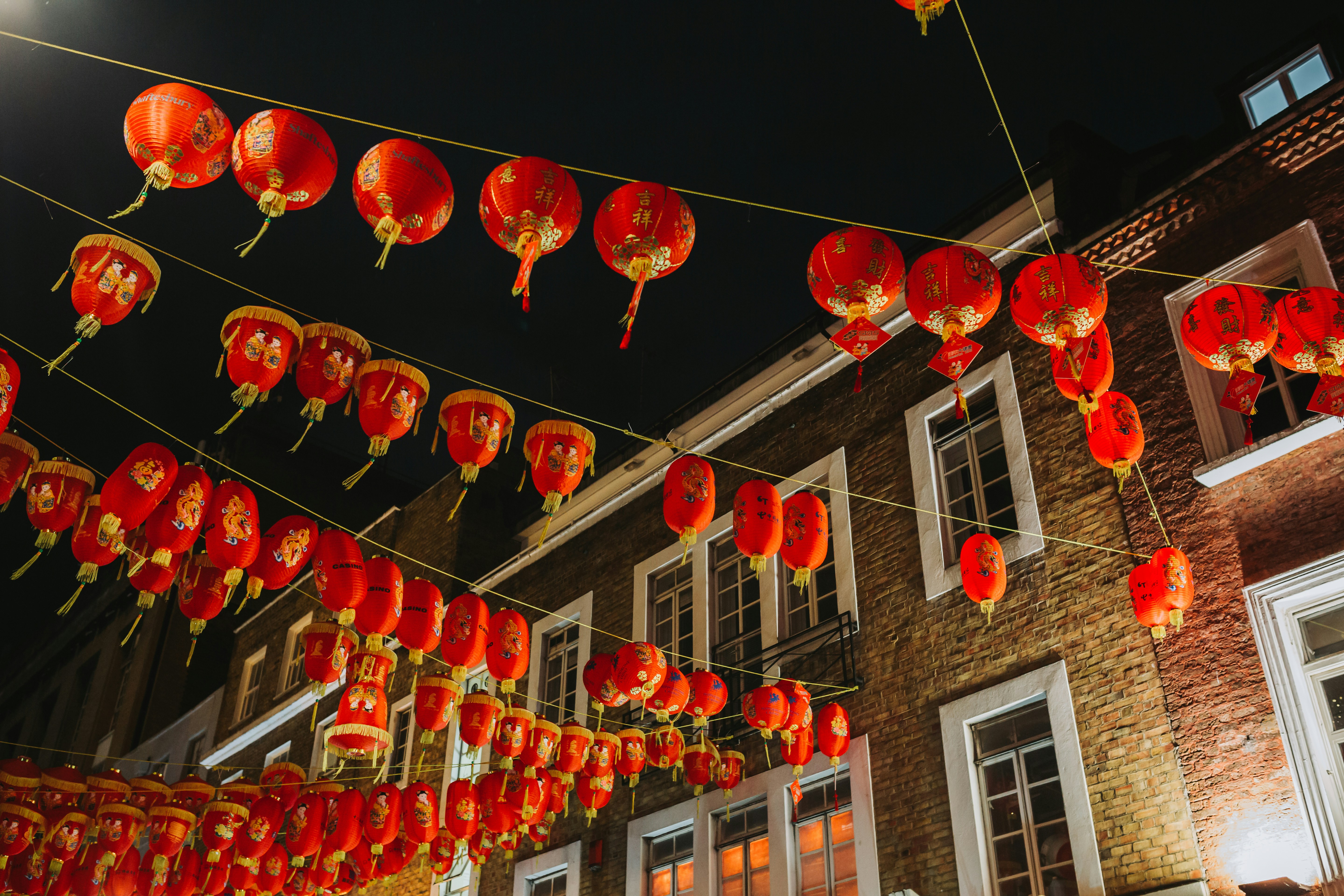 a building with lanterns from the ceiling
