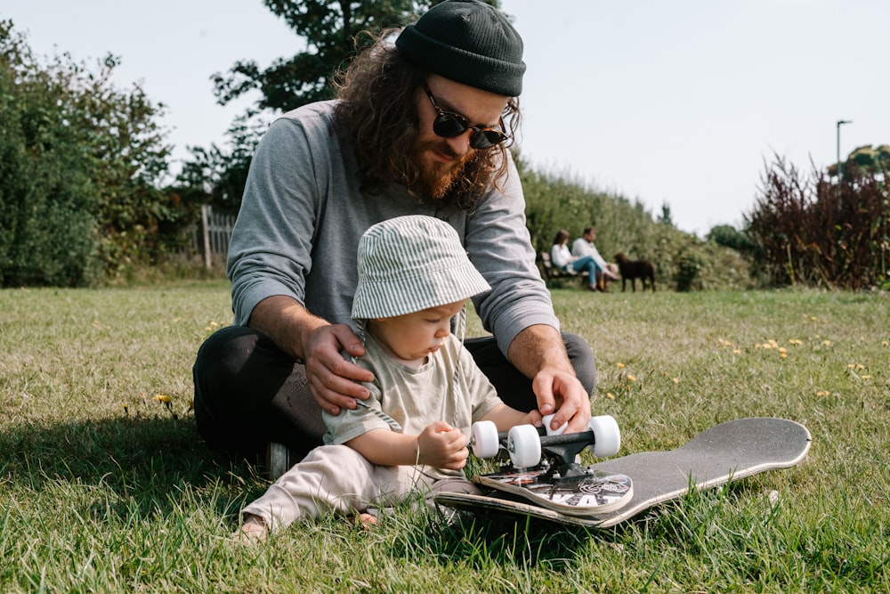 a person with a beard and a baby on a skateboard