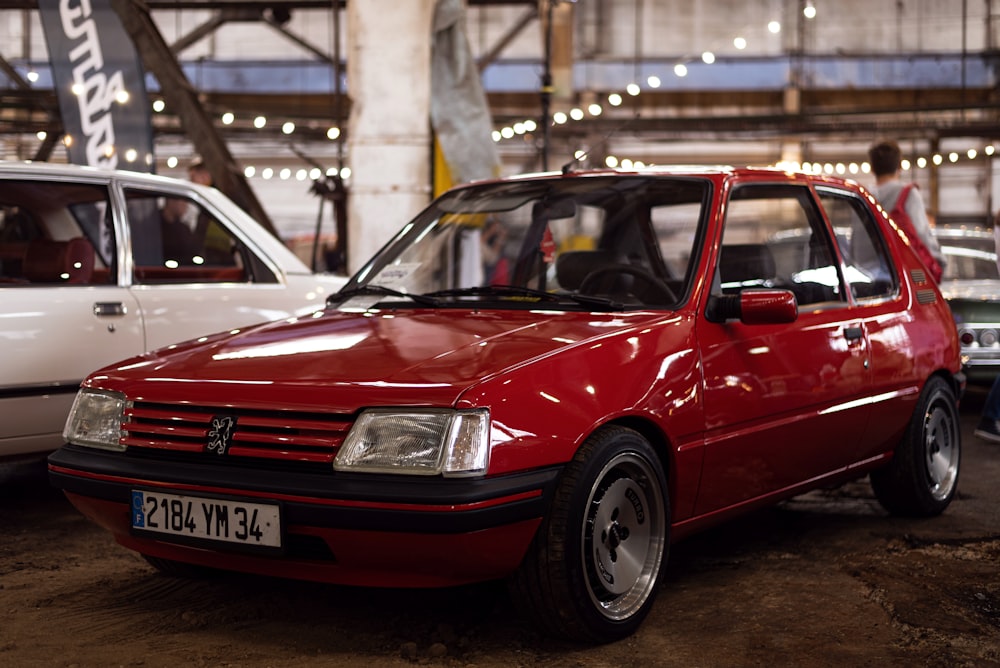 a red car parked in a building