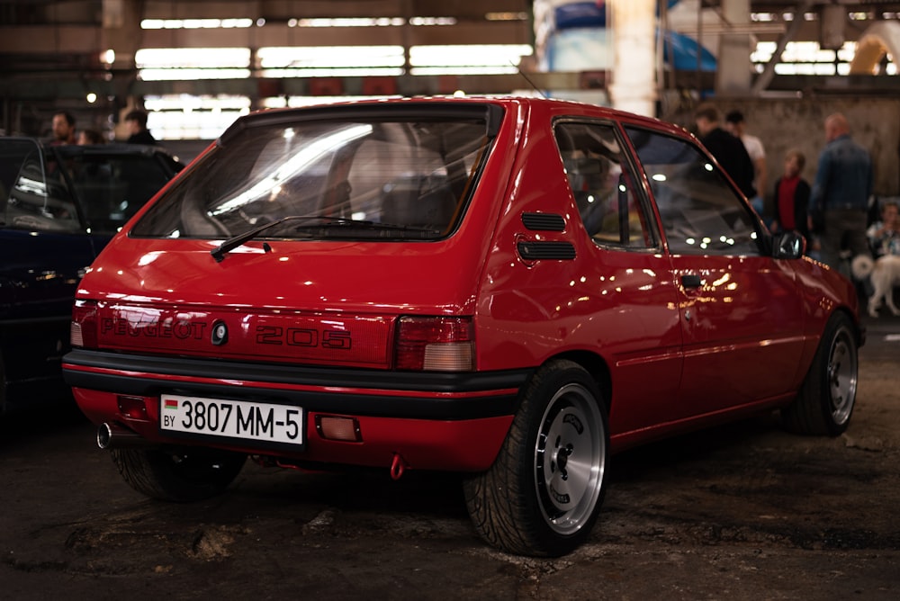 a red car parked in a building