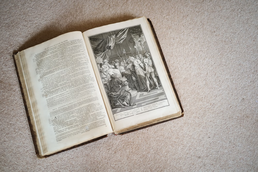 an open book on a carpet