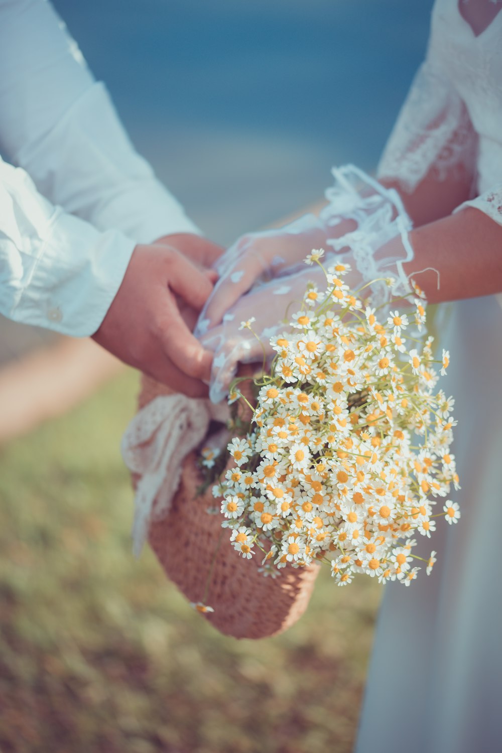 a person holding a bouquet of flowers