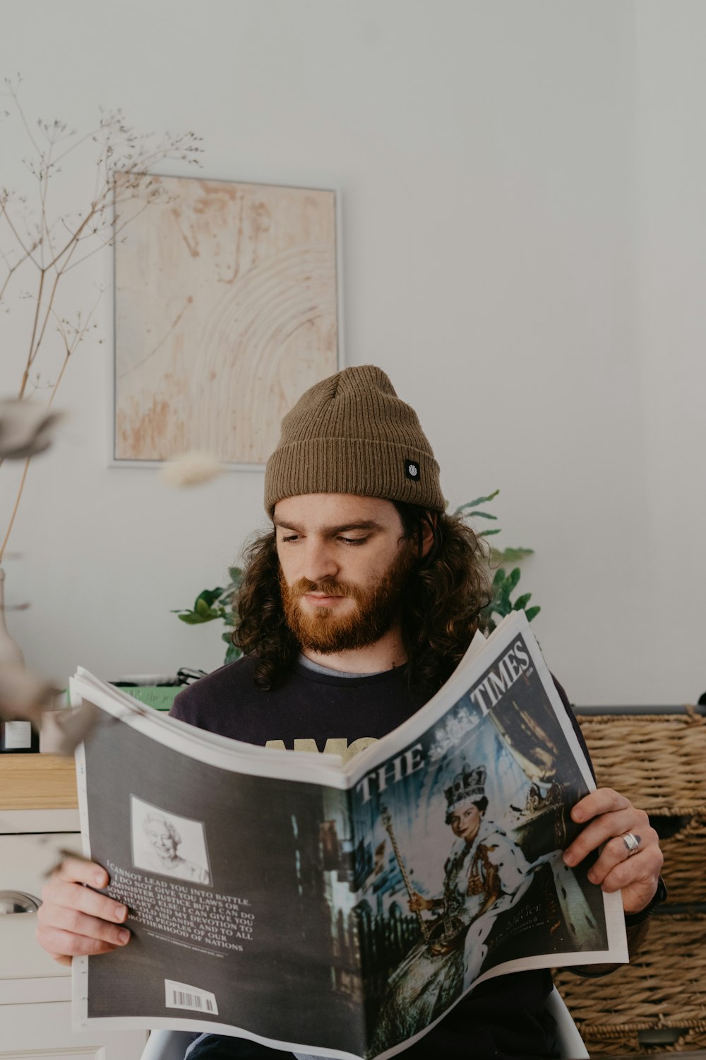 a person with a beard reading a book