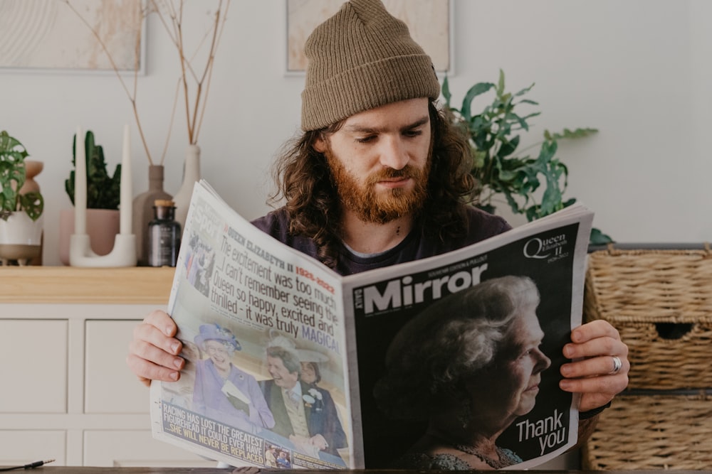 a person with a beard reading a book