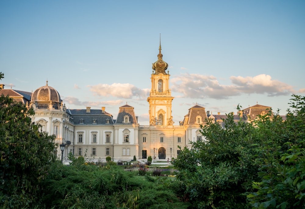 a large white building with a tower