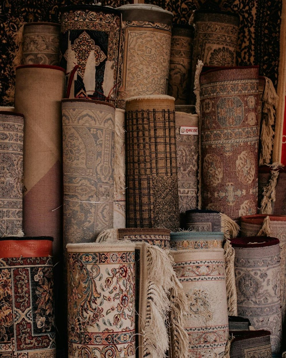 a group of vases sit on a shelf