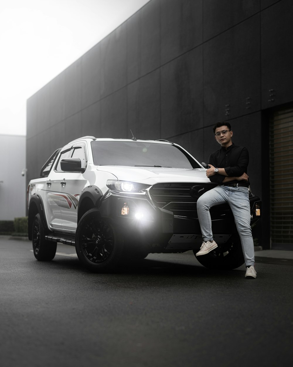 a man sitting on a car