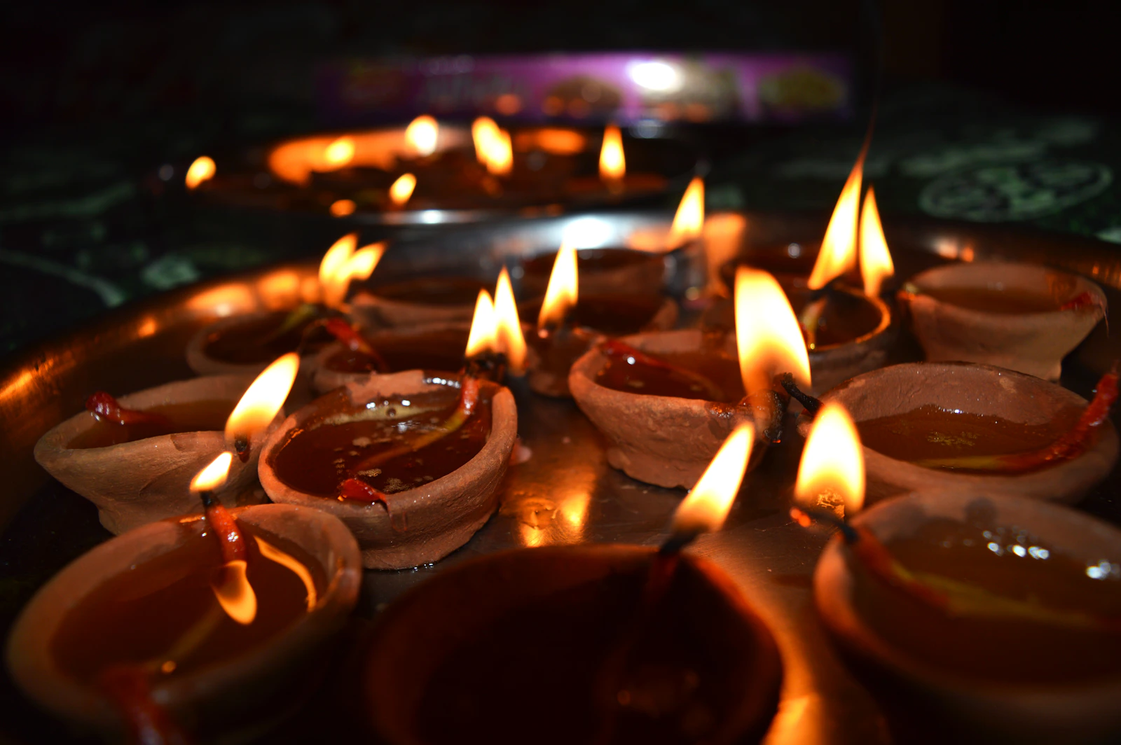 Oil lamps lit in a group.