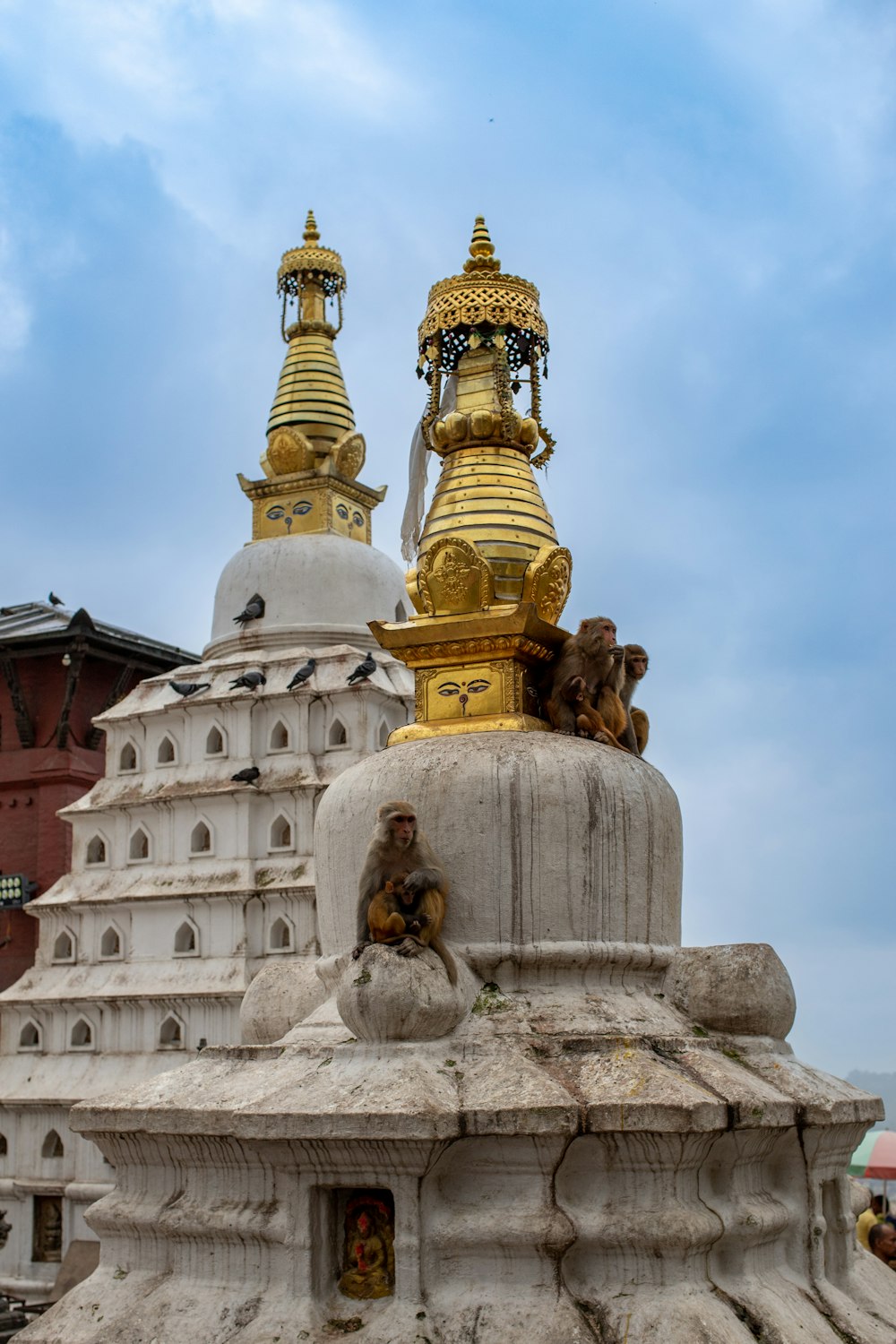 a large building with a statue in front of it