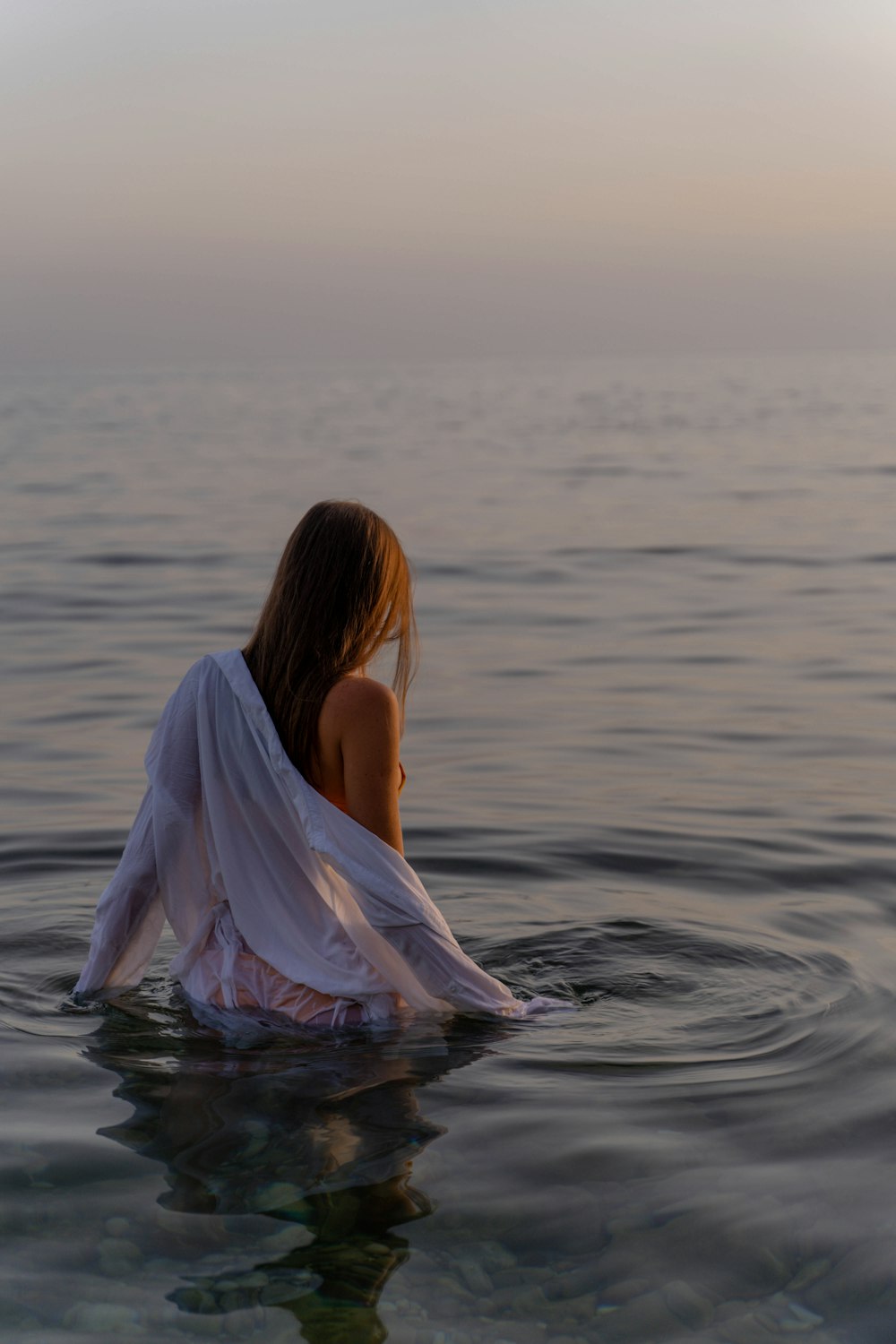 a person sitting in the water