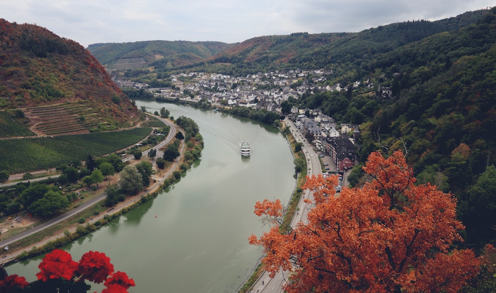 a river with a boat on it and a city in the background