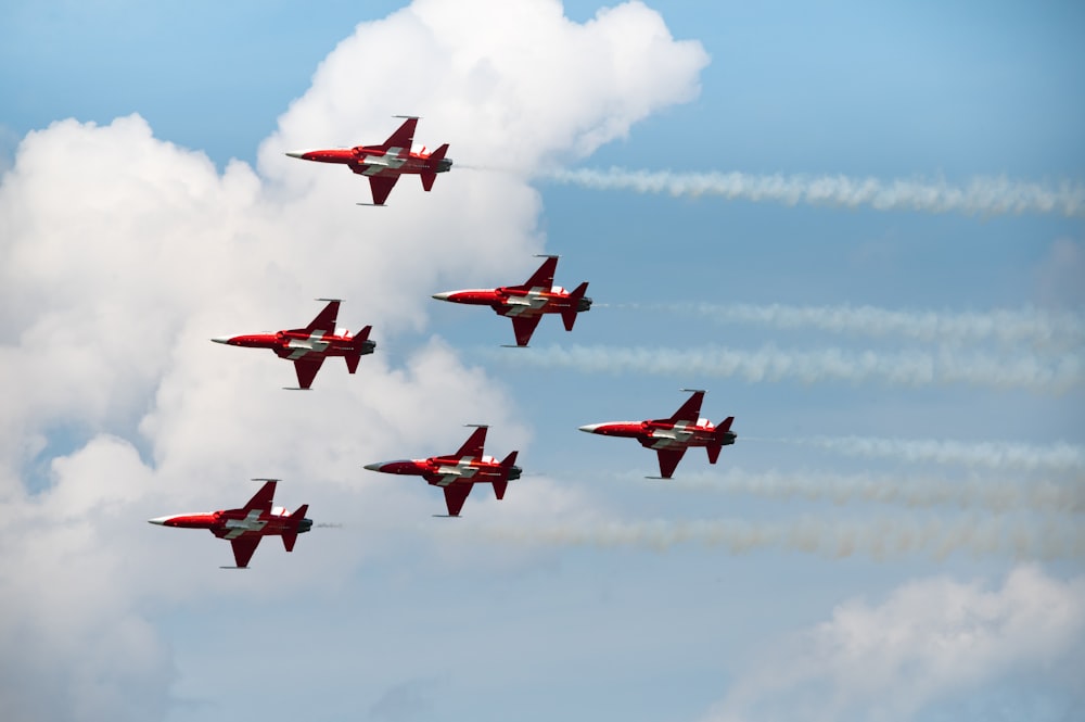 a group of airplanes flying in formation