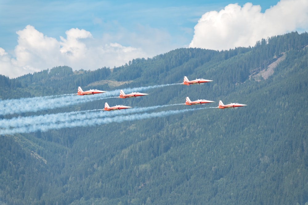 a group of airplanes flying in the sky