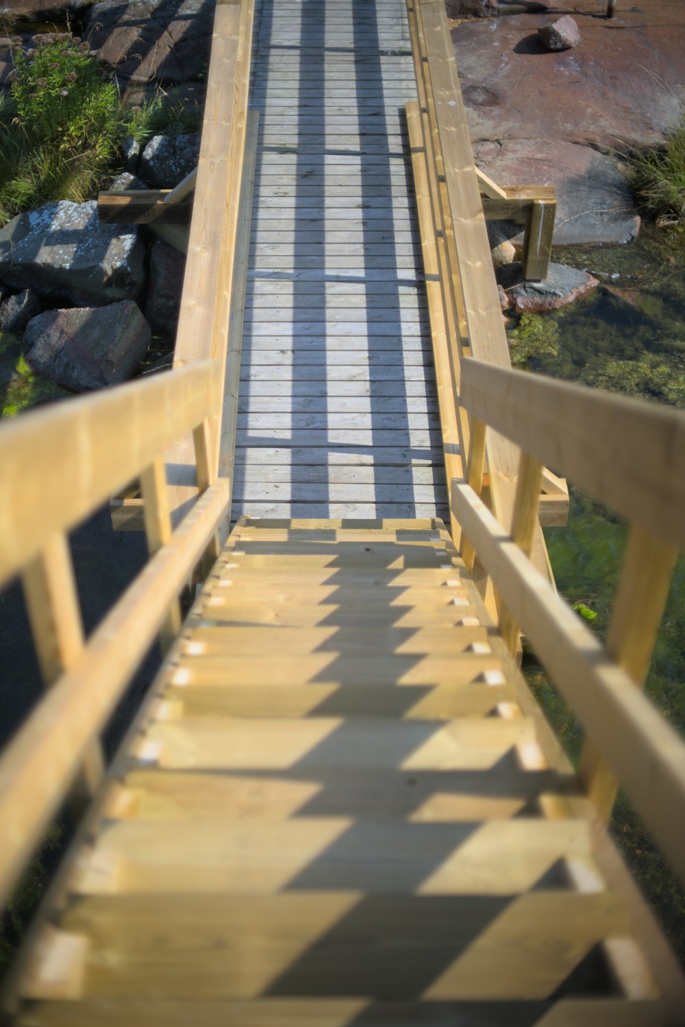 a wooden bridge over a river