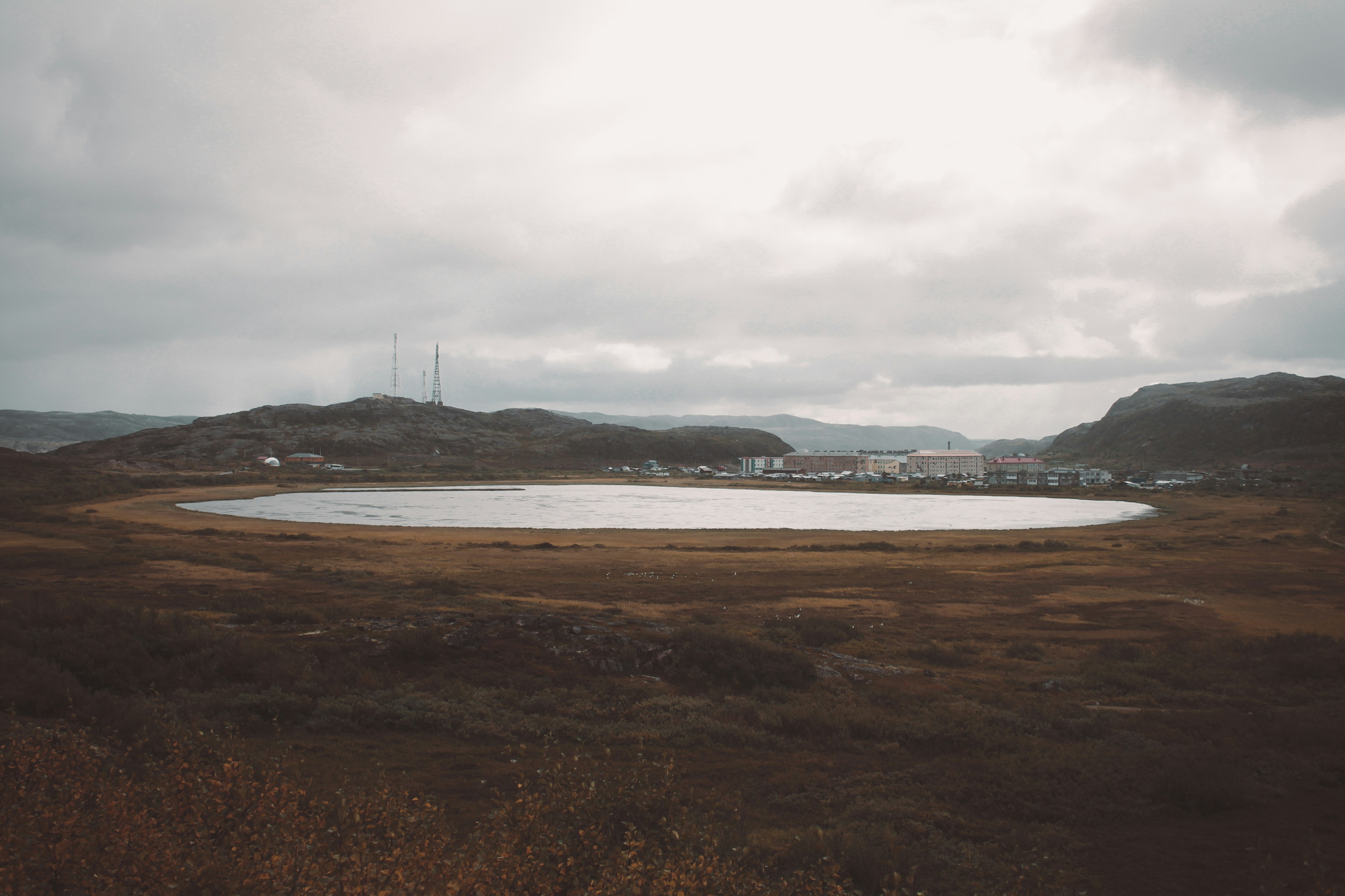 a large body of water with a land in the back