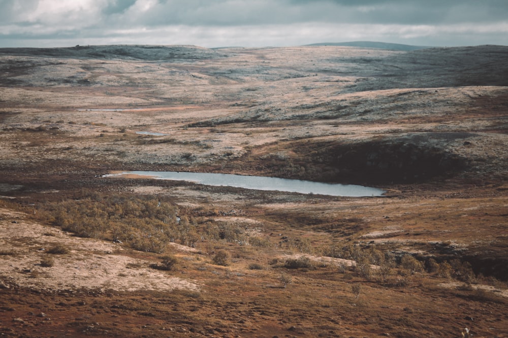 a large area of land with a body of water in it