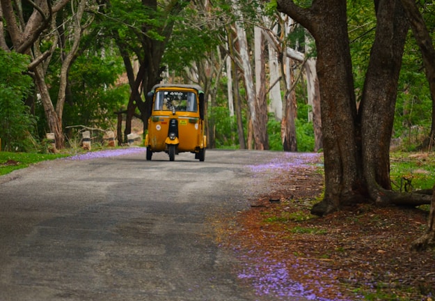 a yellow van on a road