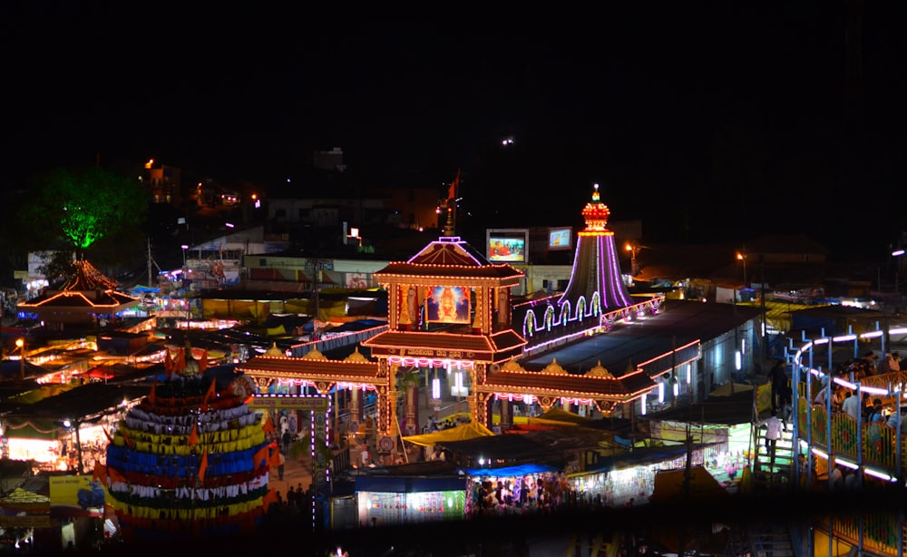 a group of colorful buildings with lights