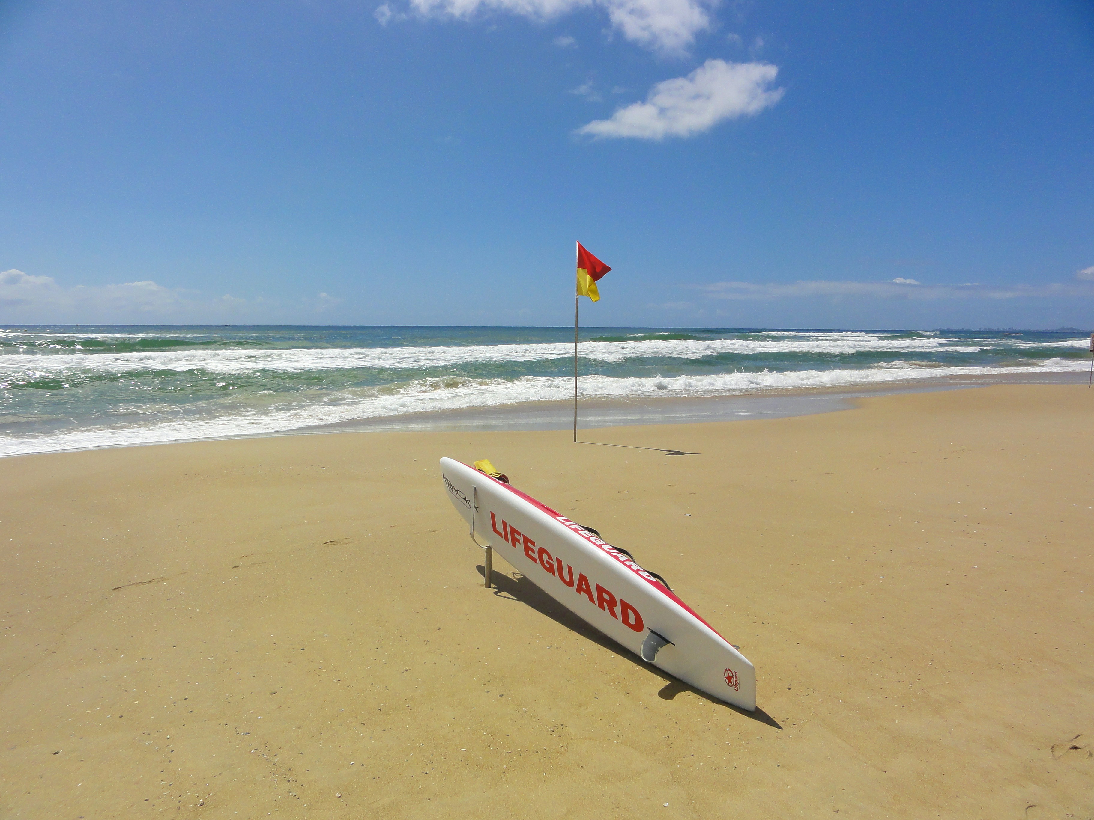 a surfboard on a beach