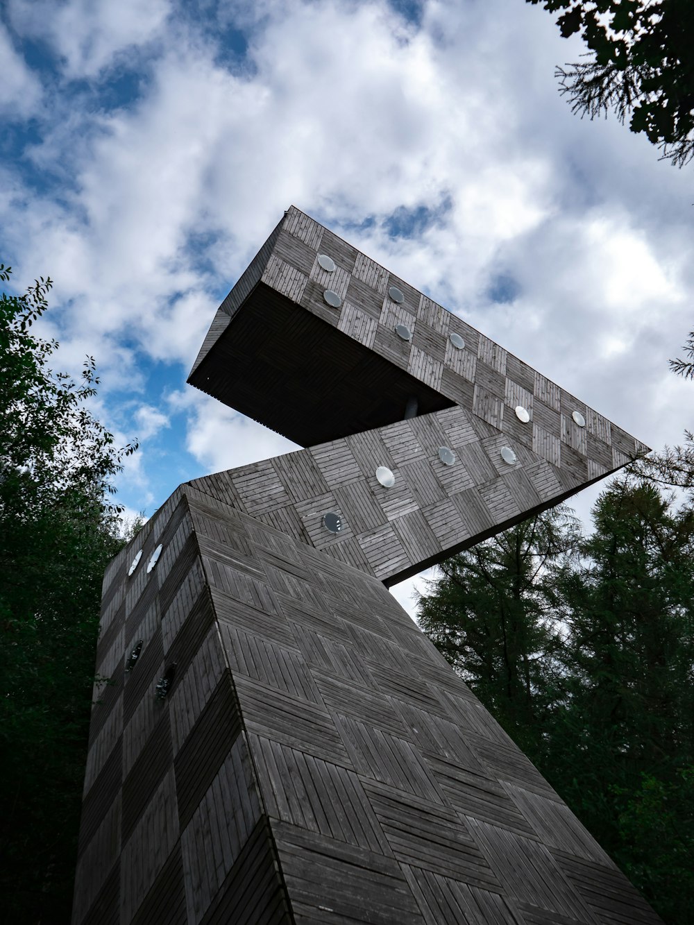 a tall building with trees around it