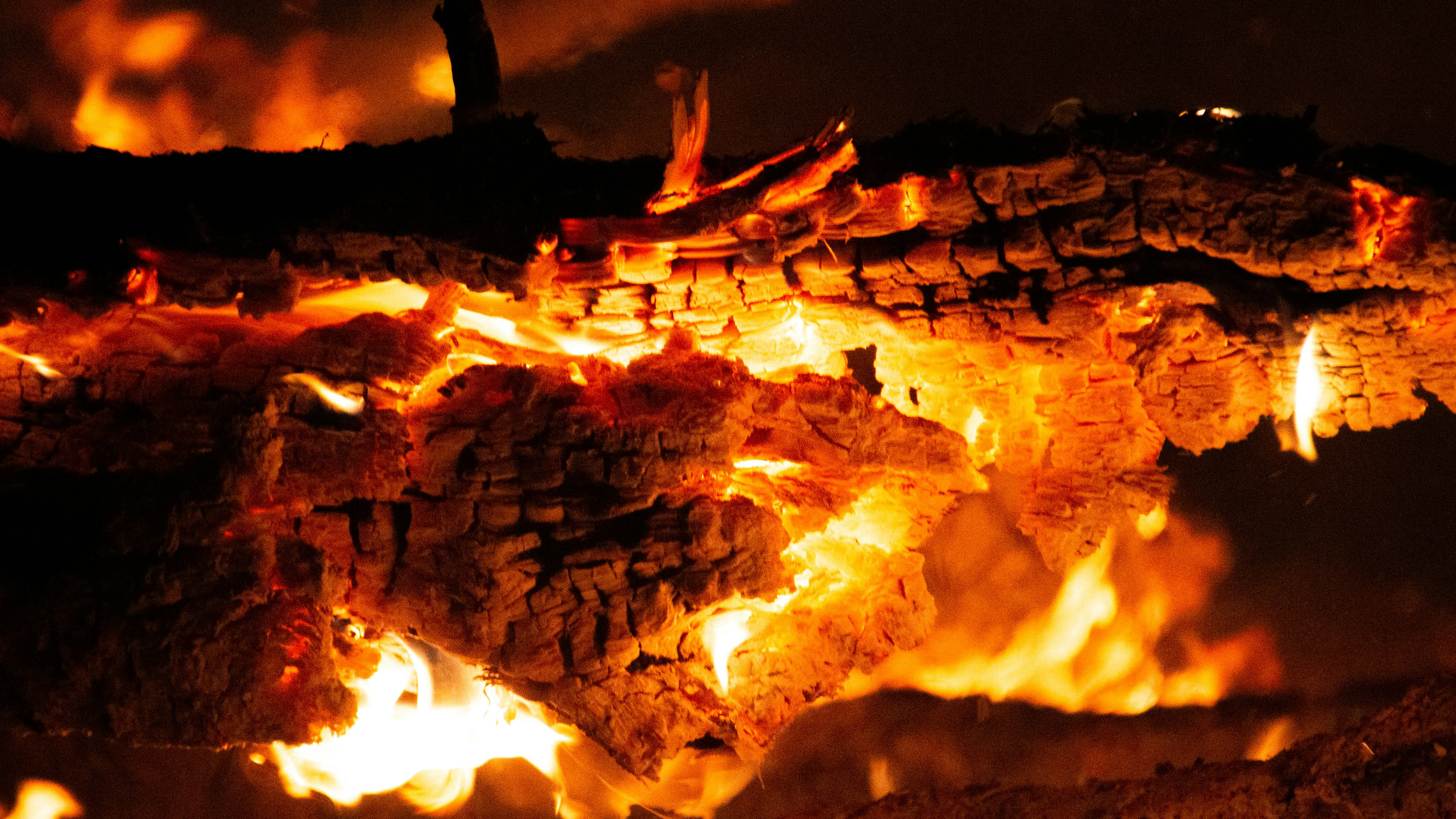 a fire burning in a pit