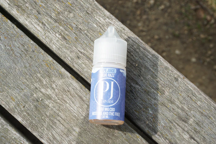 E-liquid bottle on a wooden surface