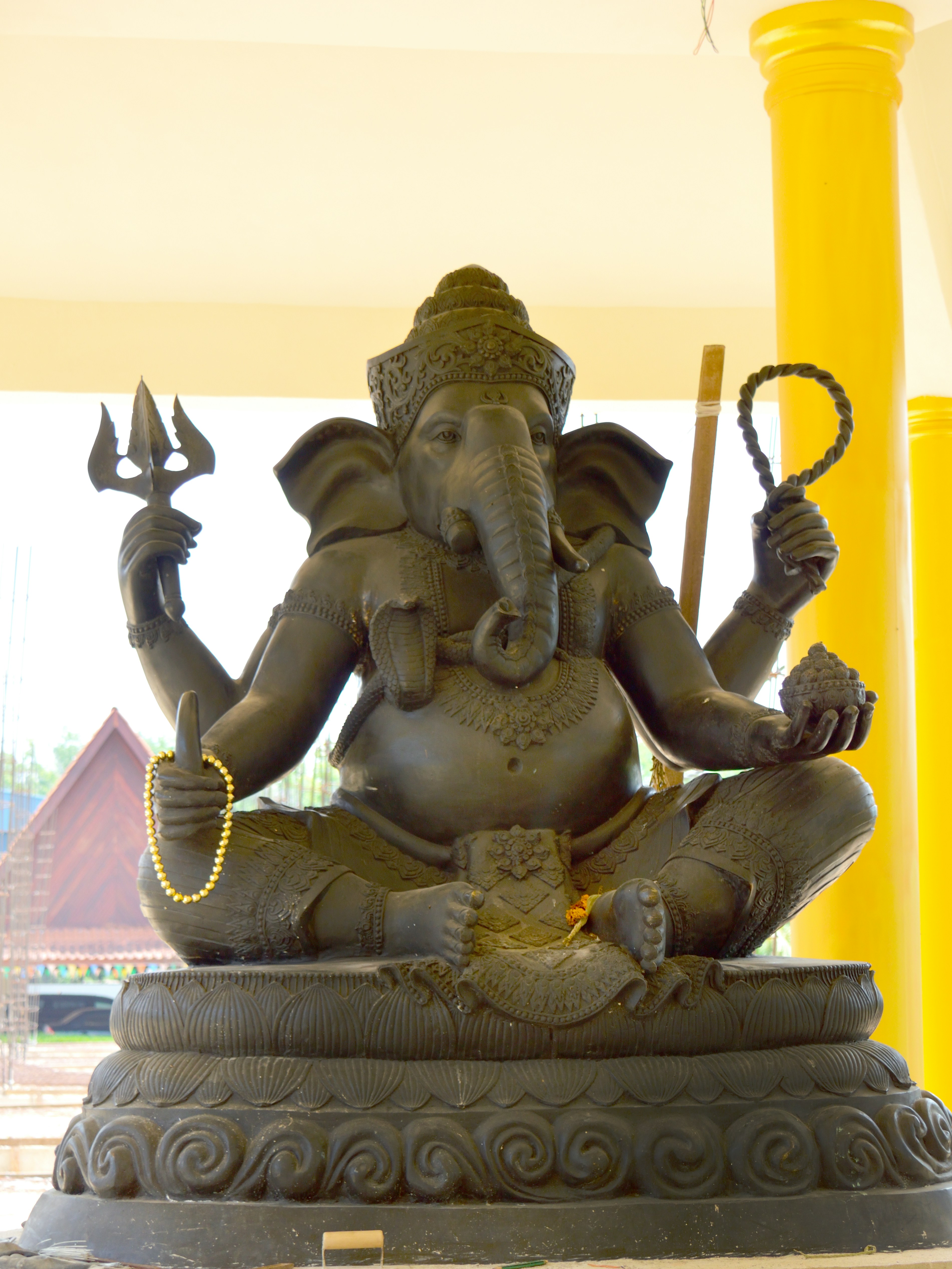 a statue of a person holding a staff