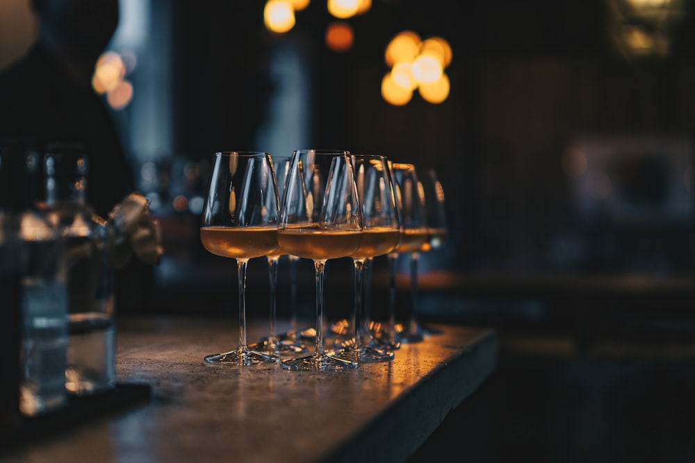 a group of glasses with liquid in them