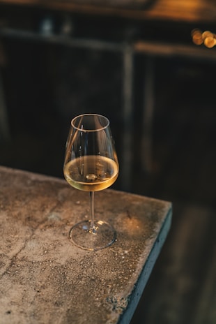 a glass of wine on a table