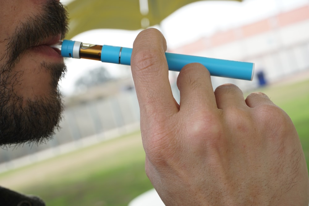 a man holding a syringe