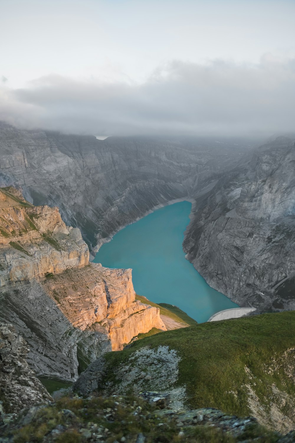 a body of water surrounded by mountains