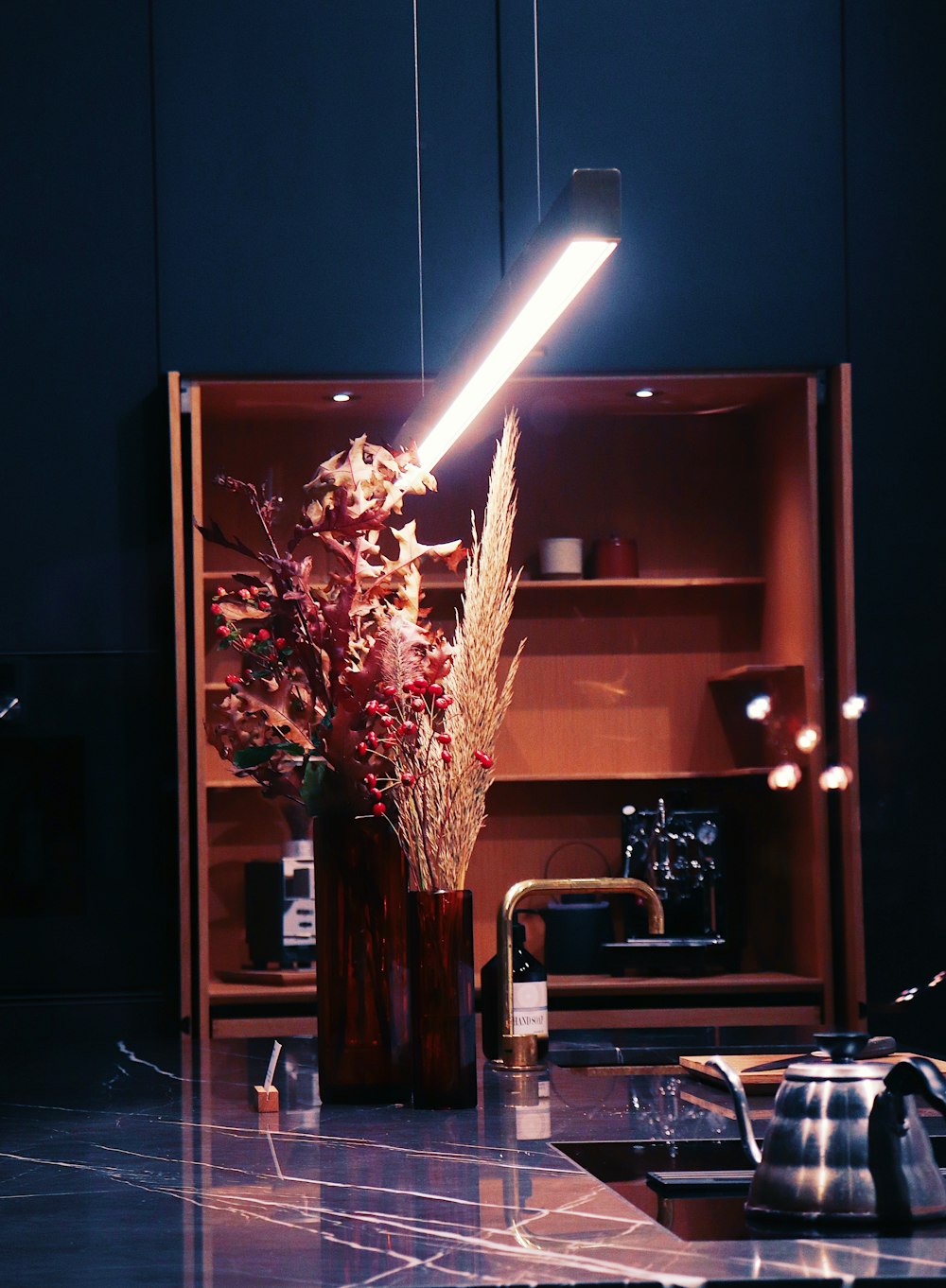 a lit candle in a vase
