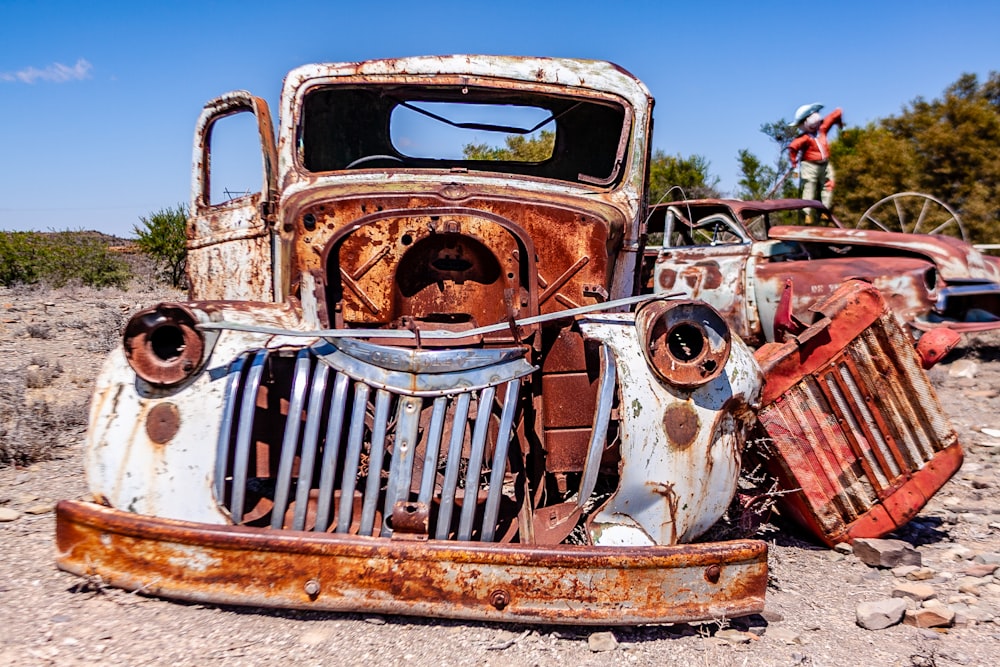 an old rusted out car