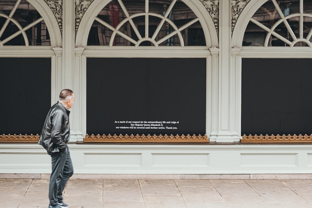 a man standing in front of a window