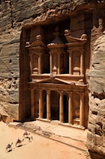 Petra with pillars and people walking around
