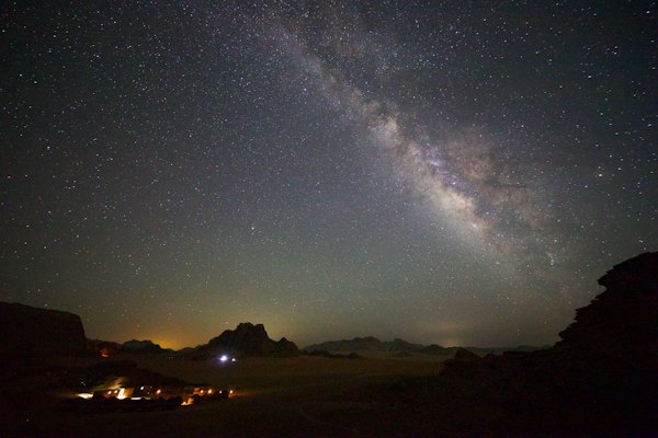 A night sky with stars and a mountain range — Wadi Rum, Jordan