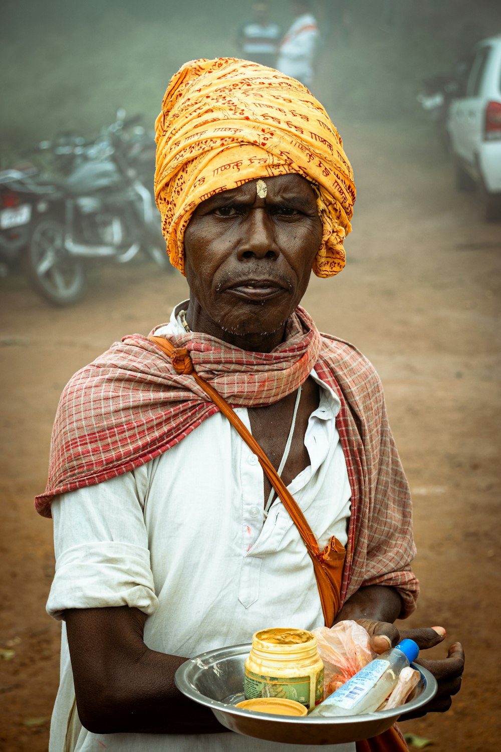 a man holding a bowl of food