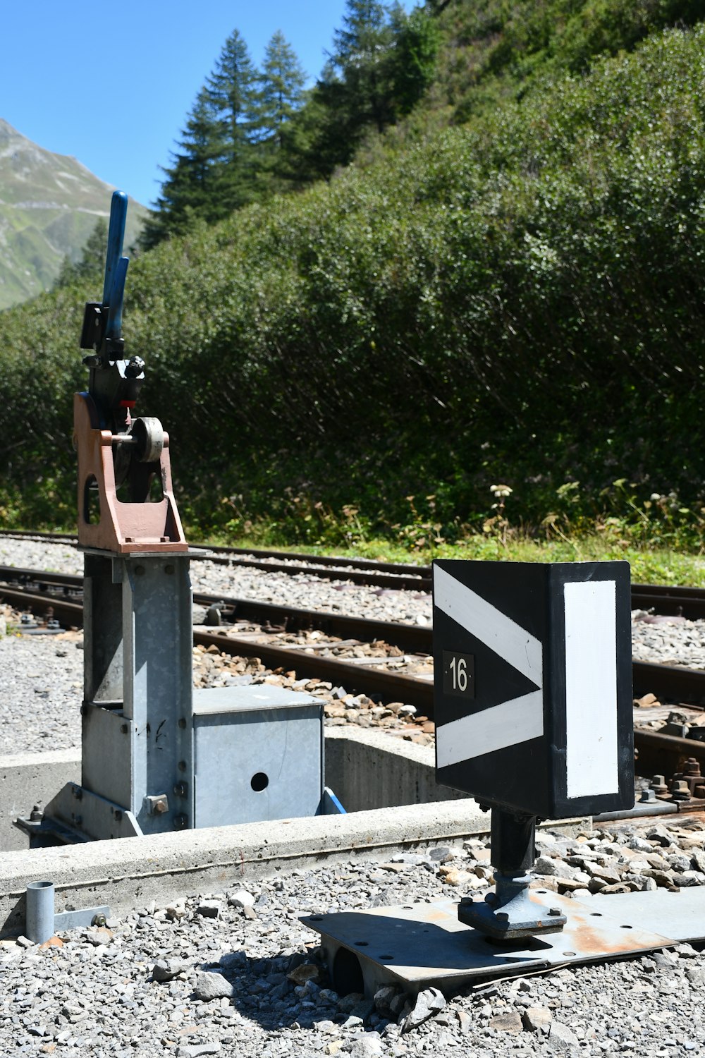 a train track with a sign on it