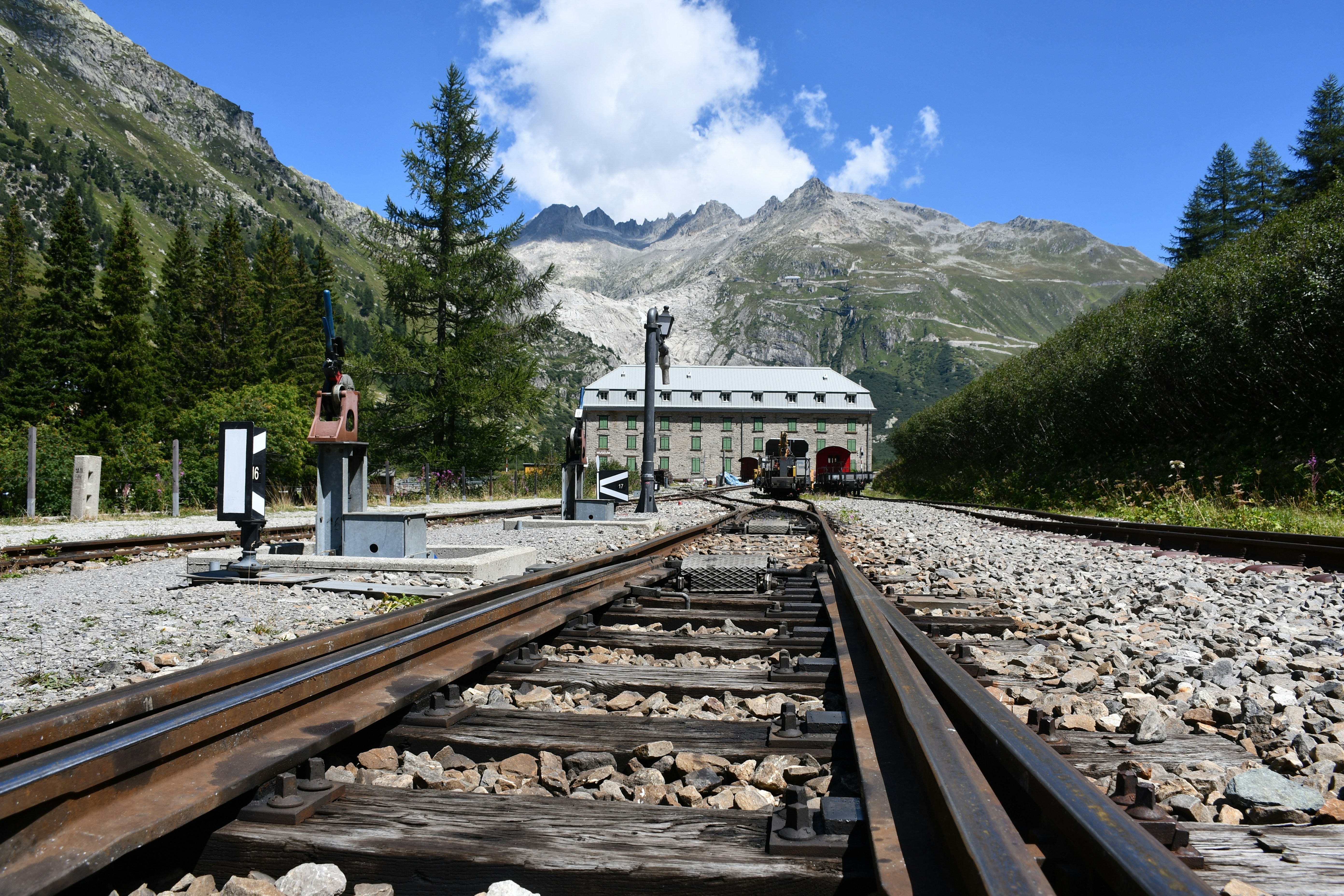 train tracks with a building in the background