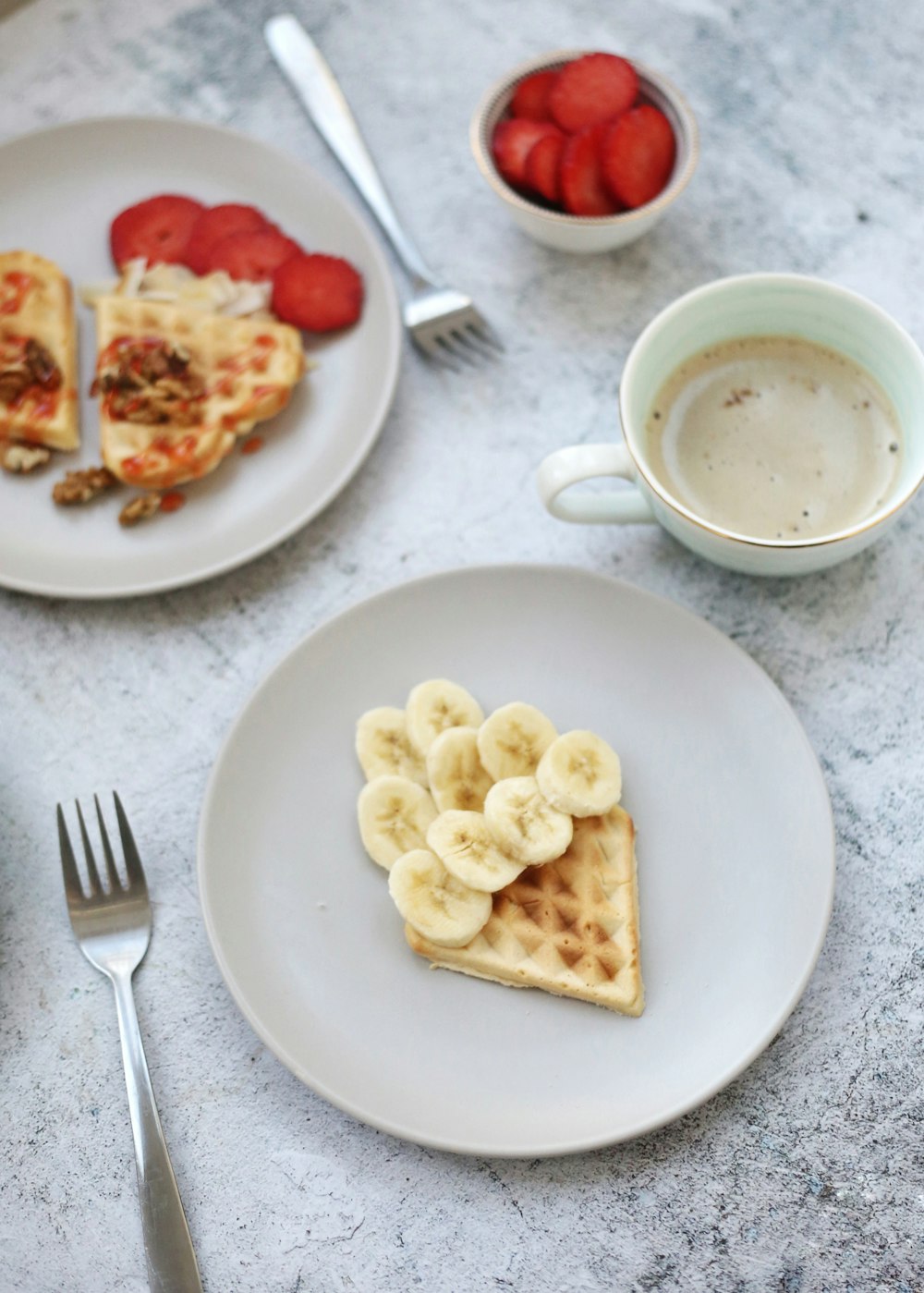 a plate of food and a cup of coffee