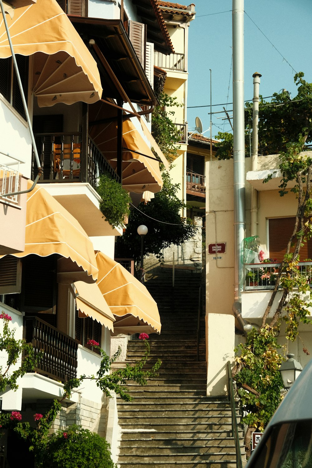 a staircase with umbrellas
