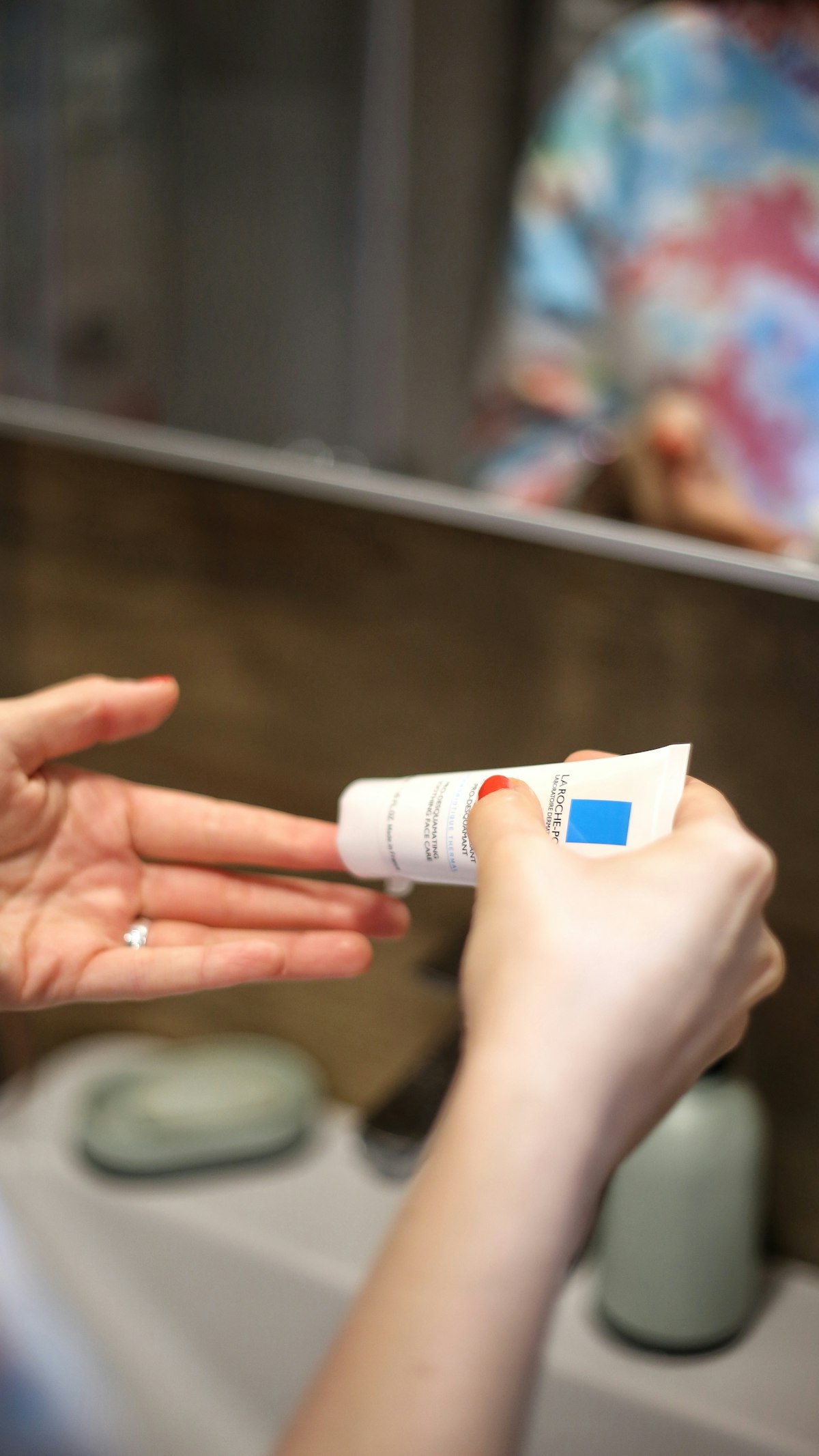 Hands applying moisturizing lotion, a simple everyday self-care ritual