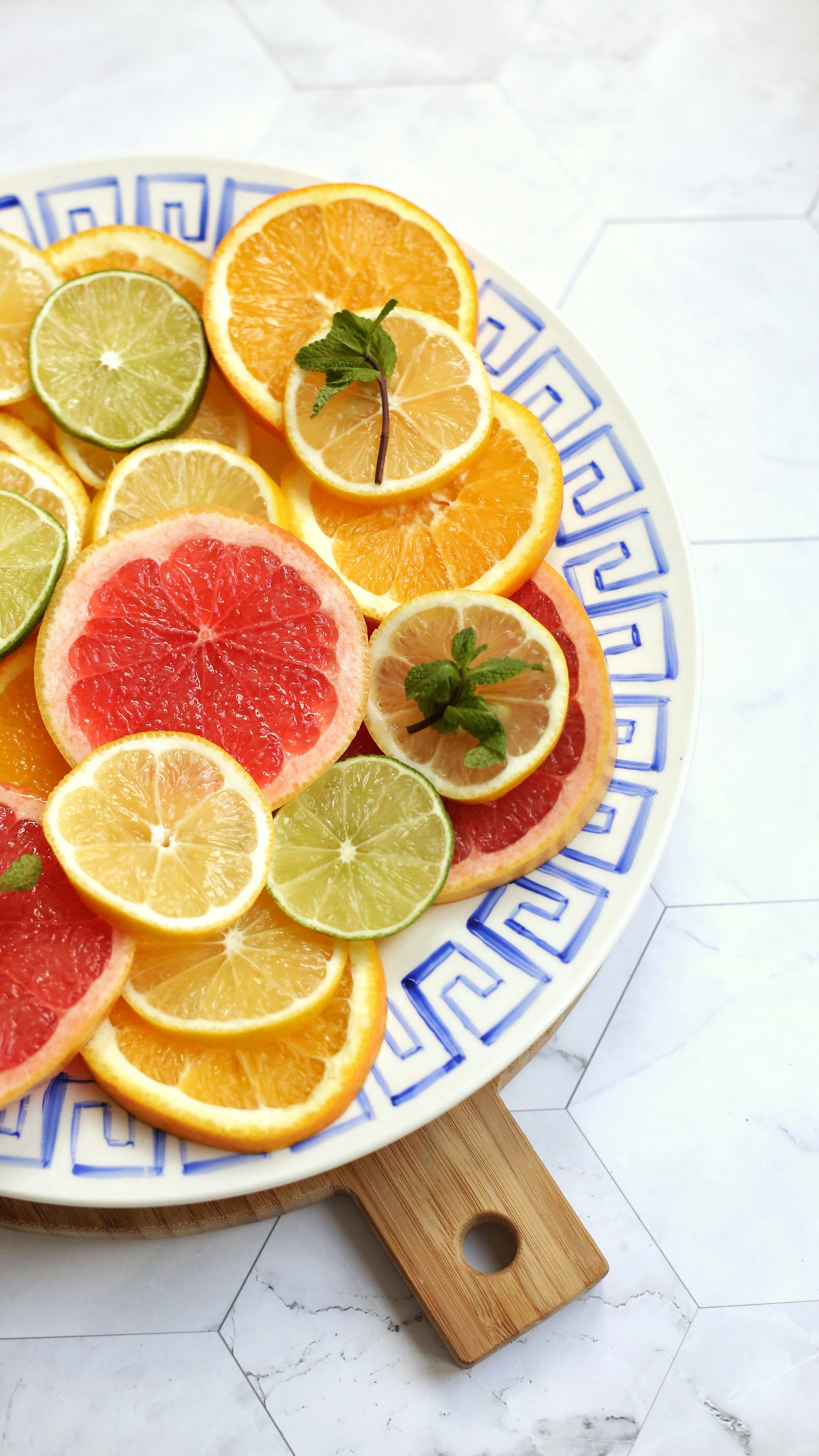 Slices of citrus fruits and mint leaves for flavoring